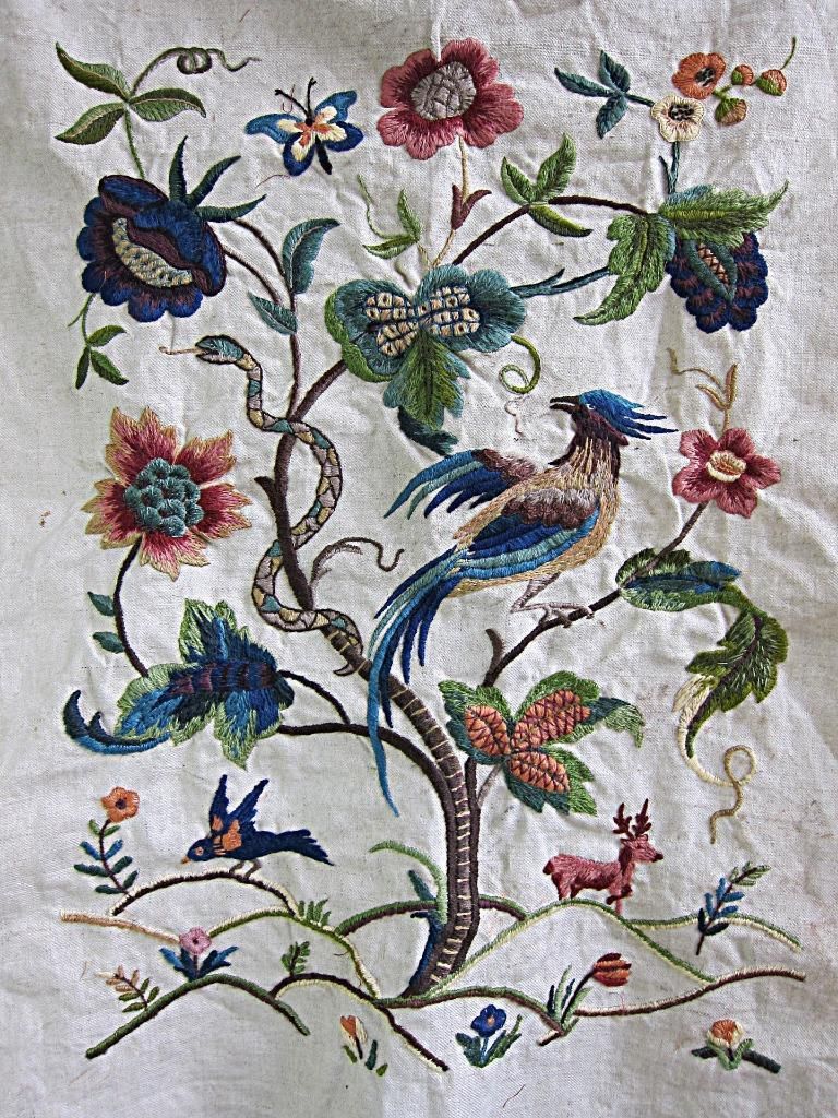 Beautiful embroidery depicting tree and birds and snakes