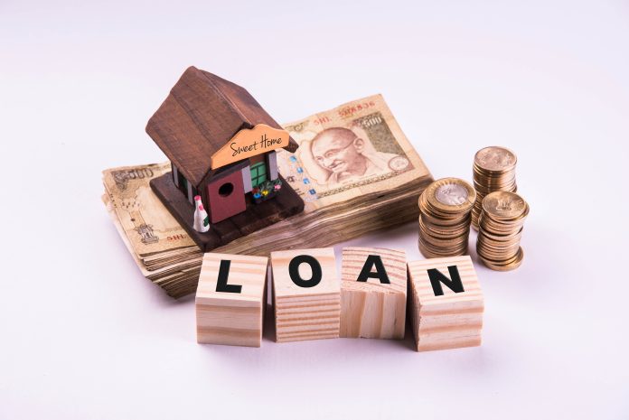 Finance and Housing Loan or purchase in India - Concept showing 3D house model, indian currency notes and calculator etc